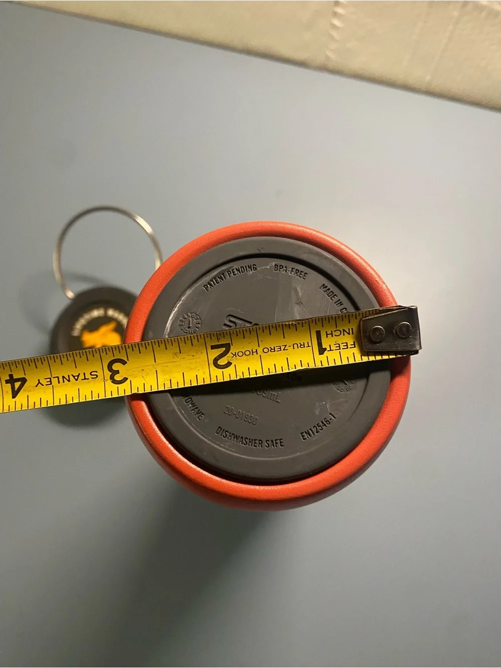 Stanley Orange Tumbler with Black Lid and White Band